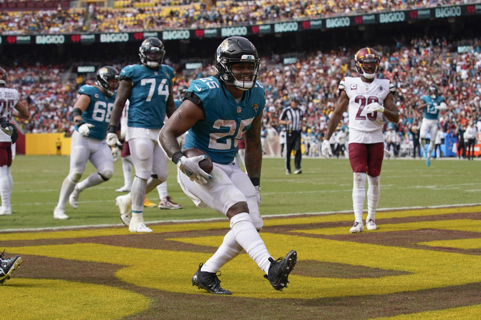 Jacksonville Jaguars running back James Robinson (25) scoring a touchdown against the Washington Commanders during the second half of an NFL football game, Sunday, Sept. 11, 2022, in Landover, Md. (AP Photo/Patrick Semansky)