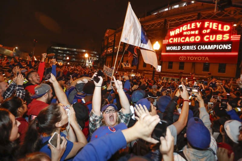 Chicago Cubs fans celebrate outside the Wrigley Field after the Game 7 of the World Series win against the Cleveland Indians on November 2 in Chicago. On August 8, 1988, the first night game at Chicago's Wrigley Field was played. File Photo by Kamil Krzaczynski/UPI