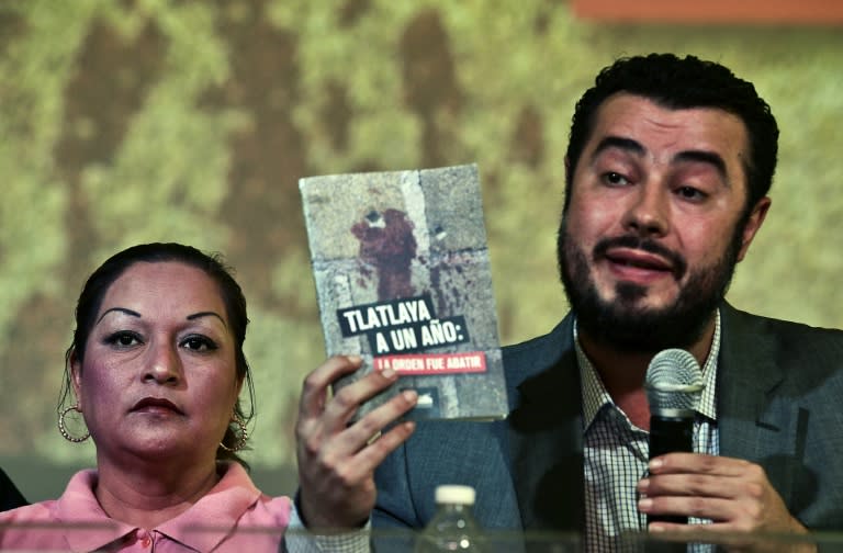 The director of Prodh human rights centre, Mario Patron Sanchez (R), speaks in Mexico City next to Clara Gomez Gonzalez, survivor and witness of an alleged extrajudicial execution of several gang members in Tlatlaya, on July 2, 2015