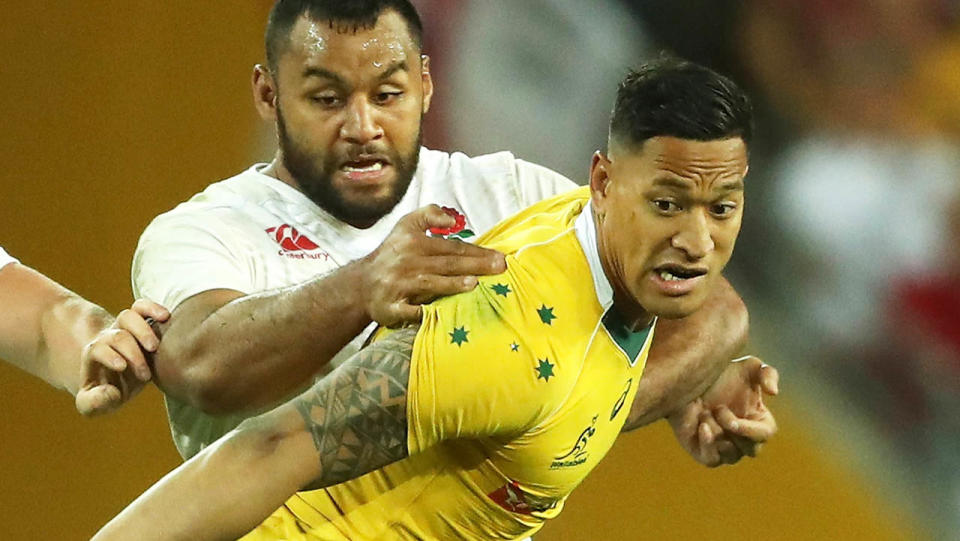 Billy Vunipola tackles Israel Folau. (Photo by David Rogers/Getty Images)