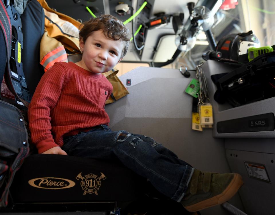 Mason Records sits in a fire truck Tuesday, Nov. 14, 2023, at the Salisbury Fire Department Station 2 in Salisbury, Maryland.