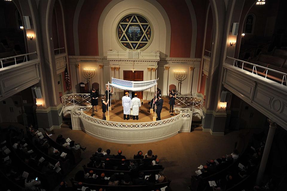 Steve Greenberg, often described as the first openly gay Orthodox rabbi, performs a wedding in 2011 for two men. <a href="https://www.gettyimages.com/detail/news-photo/ron-kaplan-and-yoni-bock-get-married-at-sixth-and-i-news-photo/145575462?phrase=gay%20orthodox%20wedding&adppopup=true" rel="nofollow noopener" target="_blank" data-ylk="slk:The Washington Post via Getty Images;elm:context_link;itc:0;sec:content-canvas" class="link ">The Washington Post via Getty Images</a>