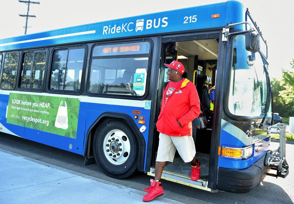 Robert Lewis of Kansas City says goodbye to the driver and exits the No. 404 bus. Lewis spends more than an hour on the bus to get to his warehouse job in Olathe.