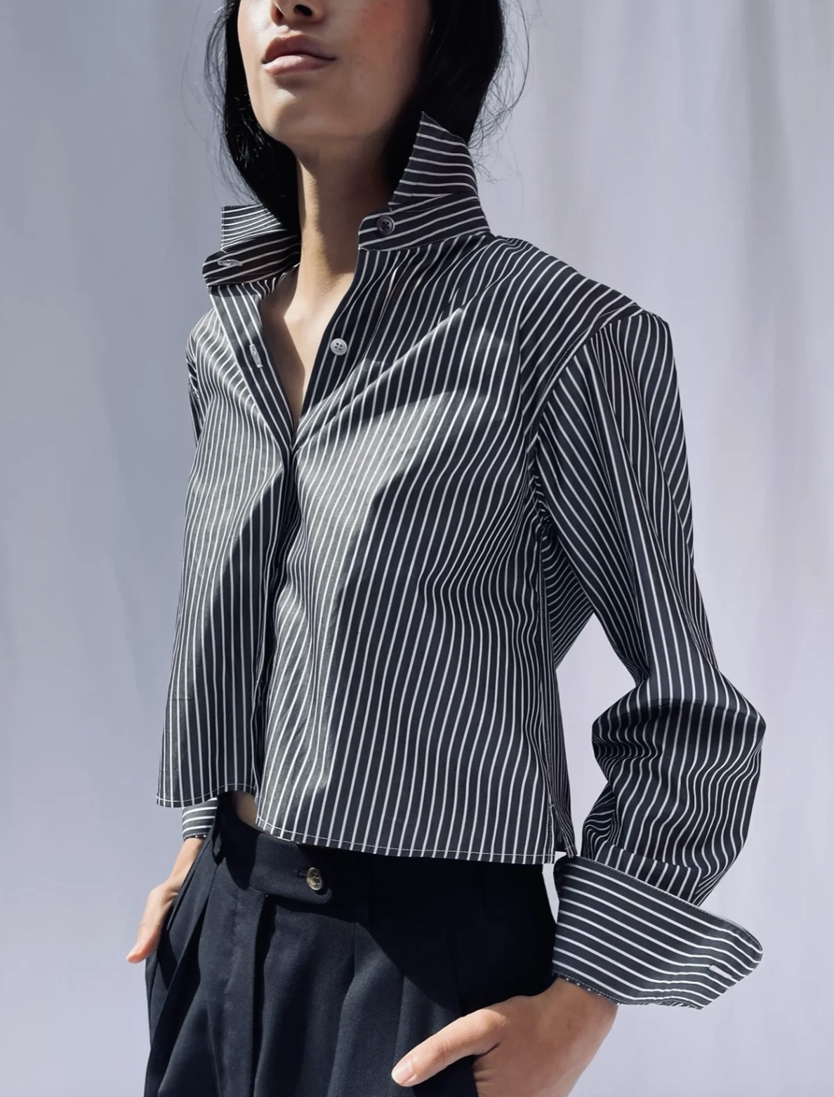 <p><a href="https://chavastudio.com/collections/made-to-order-clothing/products/cropped-shirt-in-charcoal-stripe" rel="nofollow noopener" target="_blank" data-ylk="slk:Shop Now;elm:context_link;itc:0;sec:content-canvas" class="link rapid-noclick-resp">Shop Now</a></p><p>Cropped Shirt</p><p>chavastudio.com</p><p>$315.00</p><span class="copyright">Chava Studio</span>