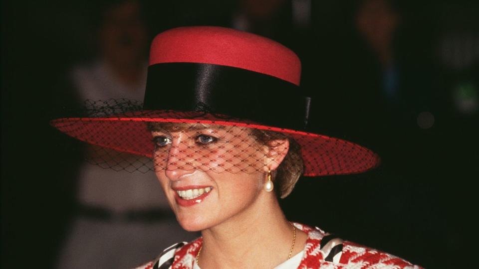 Diana, Princess of Wales (1961 - 1997) arrives at Toronto airport for an official visit to Canada, 23rd October 1991. She is wearing a red, white and black Moschino suit and a hat by Philip Somerville