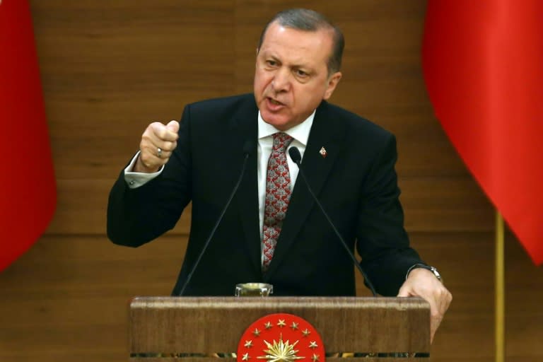 Turkey's President Recep Tayyip Erdogan (C) gives an impassioned speech on February 10, 2016 asking whether the United States is an ally or is working with groups Ankara lists as terror organisations