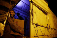 Relief workers unload parcels of humanitarian aid in the rebel-held besieged Syrian town of Douma, Damascus, Syria May 3, 2017. REUTERS/Bassam Khabieh TPX IMAGES OF THE DAY