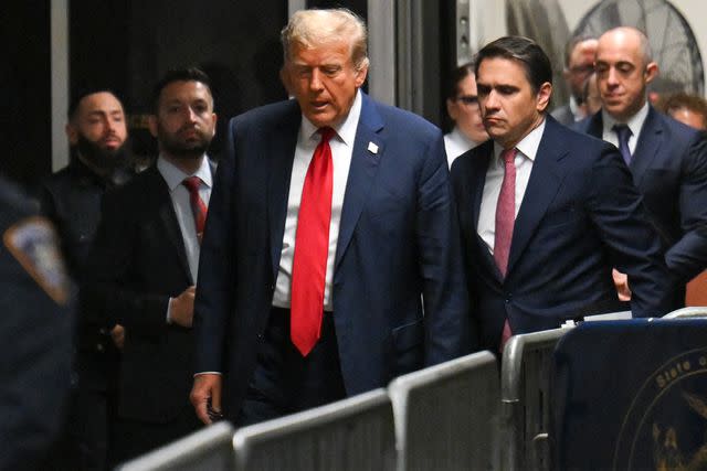<p>ANGELA WEISS/POOL/AFP via Getty</p> Former President Donald Trump attends the first day of his Manhattan criminal trial on April 15, 2024