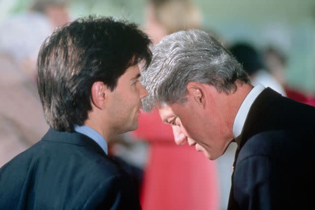 <p>Wally McNamee/CORBIS/Corbis via Getty</p> George Stephanopoulos whispers to President Bill Clinton after a White House event