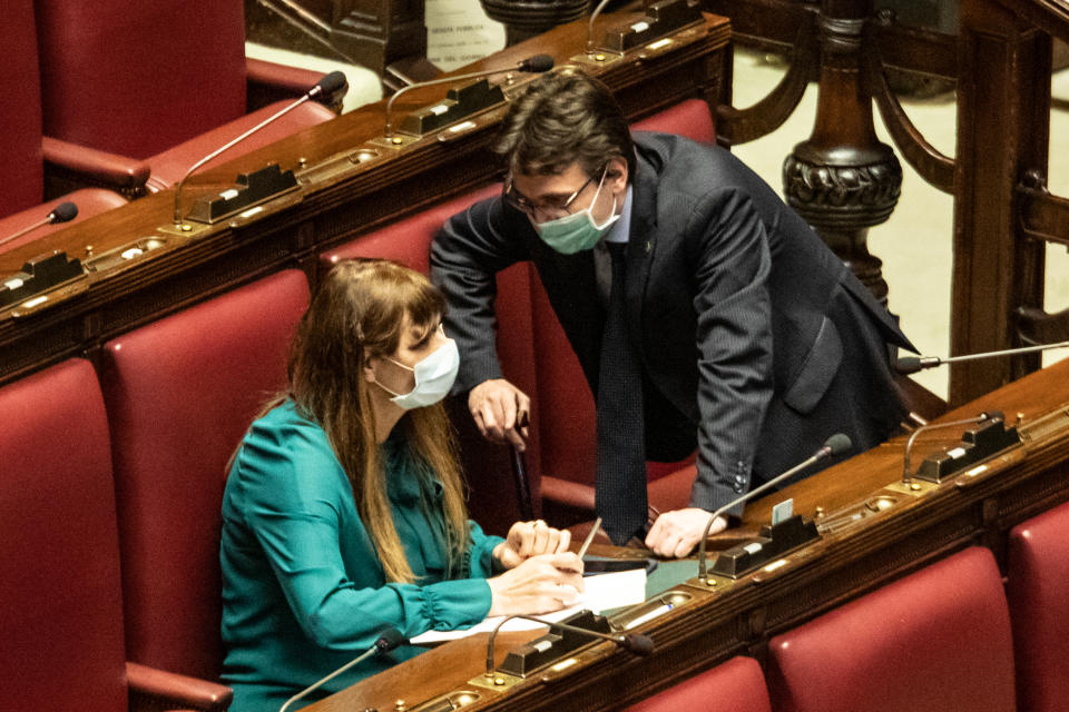  Forza Italia MP Matteo Dall'Osso and Maria Teresa Baldini of the Brothers of Italy (FDI) wearing protective masks in the Chamber during the general discussion on wiretapping. Due to the outbreak of the Covid-19 cornonavirus in Italy, most parliament member are wearing face masks as a preventive measure from the virus to spread. (Photo by Cosimo Martemucci / SOPA Images/Sipa USA) 