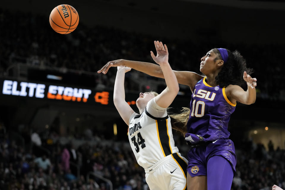 LSU forward Angel Reese (10) blocks a shot attempt by Iowa forward AJ Ediger (34) during the second quarter of an Elite Eight round college basketball game during the NCAA Tournament, Monday, April 1, 2024, in Albany, N.Y. (AP Photo/Mary Altaffer)