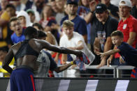 United States' Tim Weah, left, gives his jersey to a fan as he leaves the World Cup qualifying soccer match against Costa Rica during the second half Wednesday, Oct. 13, 2021, in Columbus, Ohio. The United States won 2-1. (AP Photo/Jay LaPrete)