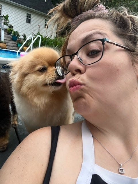 Natalie Williams of Dickson, Tenn., with her sister's dog, Jimmy Butters