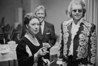 <p>Princess Margaret and her husband, Lord Snowdon, join Elton John backstage at a benefit concert in London in 1972. </p>