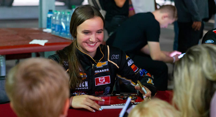 Katie Hettinger, driver of the #02 Chevrolet Performance Chevrolet, signs autographs for fans ahead of the Star Nursery 150 for the ARCA Menards Series West at the Bullring at Las Vegas Motor Speedway in Las Vegas, Nevada on October 14, 2022. (Miranda Alam/ARCA Racing)