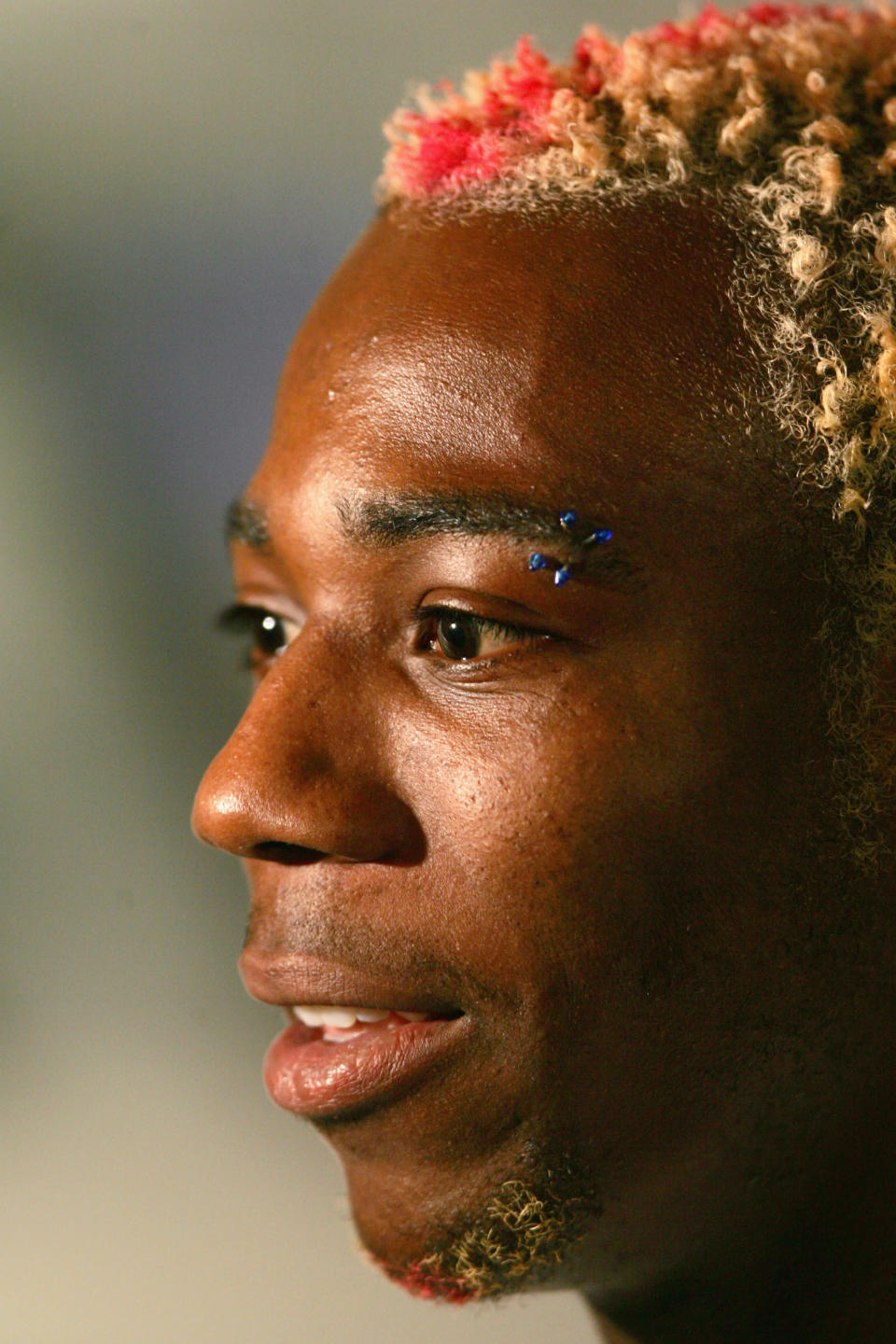 LONDON - JULY 13: Phillips Idowu is interviewed as the British Olympic Association announce the Athletics squad to represent Team GB at the Athens Olympic Games at the Millbank Tower media centre on July 13, 2004 in London, England. (Photo by Clive Rose/Getty Images)