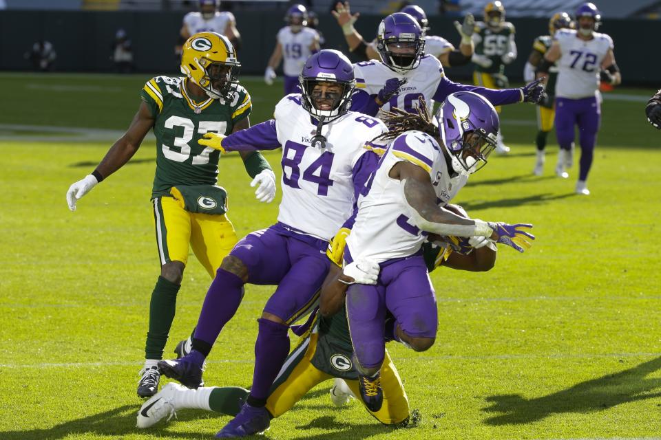 Minnesota Vikings' Dalvin Cook breaks away for a touchdown during the second half of an NFL football game against the Green Bay Packers Sunday, Nov. 1, 2020, in Green Bay, Wis. (AP Photo/Mike Roemer)