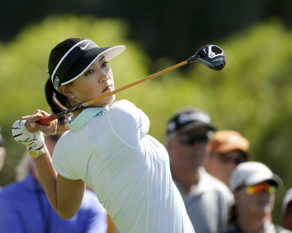 Michelle Wie watches her tee shot on the sixth hole during the final round of the Kraft Nabisco Championship golf tournament Sunday, April 6, 2014 in Rancho Mirage, Calif. (AP Photo/Chris Carlson)