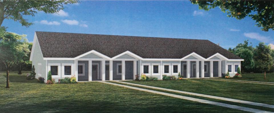 An architectural rendering shows one of several types of housing proposed as part of a more than 500-unit residential development near Mason and Burkhart roads in Howell Township.