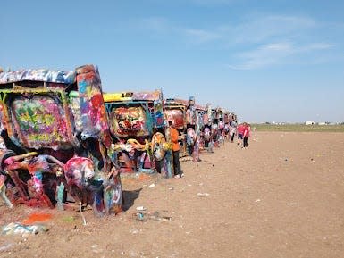 A view of the painted cars lined up at Cadillac Ranch