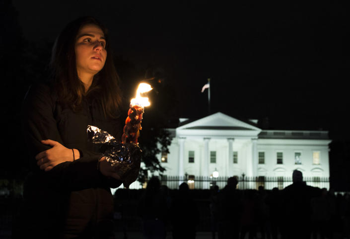 <p>Members and supporters of the Jewish community come together for a candlelight vigil, in remembrance of those who died earlier in the day during a shooting at the Tree of Life Synagogue in the Squirrel Hill neighborhood of Pittsburgh, in front of the White House in Washington, D.C. on Oct. 27, 2018. (Photo: Andrew Caballero-Reynolds/AFP/Getty Images) </p>