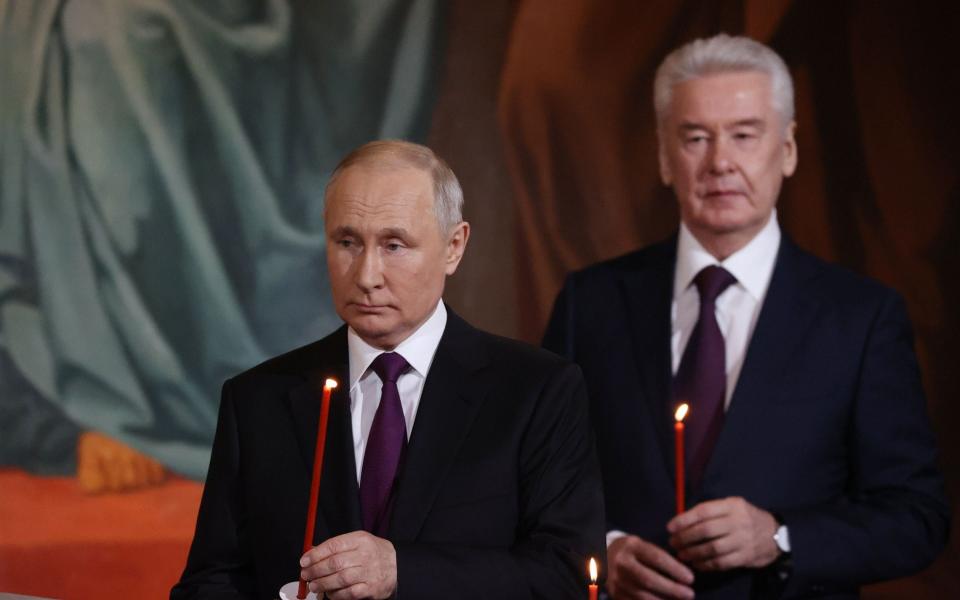 Russian President Vladimir Putin (L) and Moscow Mayor Sergei Sobyanin attend the Orthodox Easter service at the Cathedral of Christ the Saviour - SERGEI KARPUHIN/SPUTNIK/KREMLIN POOL/POOL/EPA-EFE/Shutterstock/Shutterstock