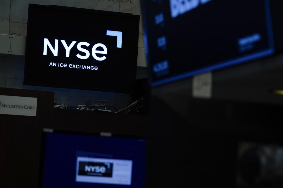 An NYSE sign is seen on the floor at the New York Stock Exchange in New York, Wednesday, June 15, 2022. Stocks are opening higher on Wall Street Thursday, June 23. The Labor Department said fewer Americans applied for jobless benefits last week as the U.S. job market remains robust. (AP Photo/Seth Wenig)