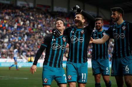 Soccer Football - FA Cup Quarter Final - Wigan Athletic vs Southampton - DW Stadium, Wigan, Britain - March 18, 2018 Southampton's Cedric Soares celebrates scoring their second goal with Dusan Tadic and teammates REUTERS/Phil Noble