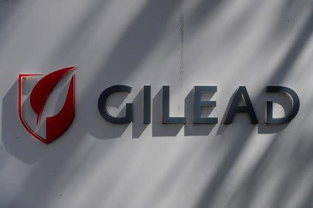 FILE PHOTO: A Gilead Sciences, Inc. logo is seen outside the company headquarters in Foster City, California, U.S. May 1, 2018. REUTERS/Stephen Lam