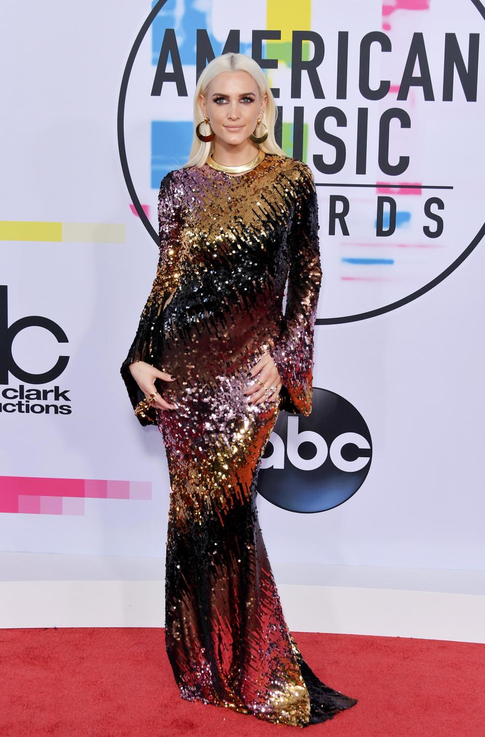 <p>Ashlee Simpson looked drop-dead gorgeous in a floor-length metallic sequinned gown.</p>