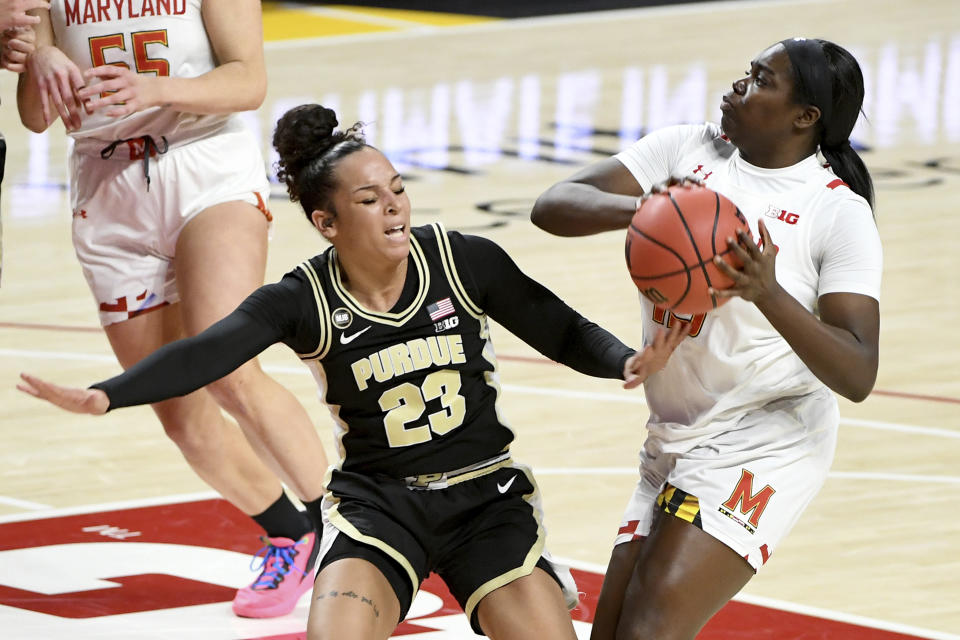 Maryland guard Ashley Owusu (15) looks to shoot in front of Purdue guard Kayana Traylor (23) during the second half of an NCAA college basketball game, Sunday, Jan. 10, 2021, in College Park, Md. (AP Photo/Will Newton)