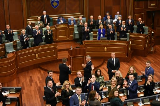 Applause in Kosovo's parliament after the vote to build an army