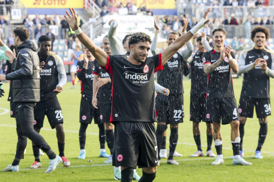 Frankfurt's Omar Marmoush celebrates after the Bundesliga soccer match between Holstein Kiel and Eintracht Frankfurt, at the Holstein Stadium in Kiel, Germany, Sunday, Sept. 29, 2024. (Frank Molter/dpa via AP)