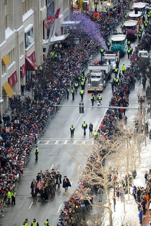 Feb 4, 2015; Boston, MA, USA; The New England Patriots minute men militia lead the parade down Boylston Street during the Super Bowl XLIX rolling rally. Brian Fluharty-USA TODAY Sports