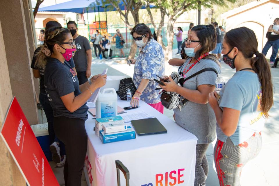 A Lift to Rise employee helps renters during a Desert Hot Springs pop-up event.