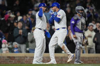 Chicago Cubs' Cody Bellinger, right, and Seiya Suzuki celebrate Bellinger's two-run home run during the seventh inning of a baseball game against the Colorado Rockies, Tuesday, April 2, 2024, in Chicago. (AP Photo/Erin Hooley)