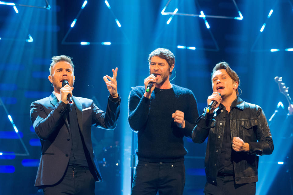 Take That (left to right) Gary Barlow, Howard Donald and Mark Owen during filming of the Graham Norton Show at the London Studios, in central London.