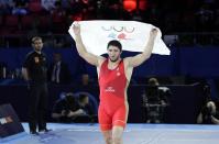 FILE - Russia's Abdulrashid Sadulaev celebrates winning the final in 97kg at the wrestling WC in Oslo, Norway, Tuesday Oct. 5, 2021. (Berit Roald/NTB via AP, File)