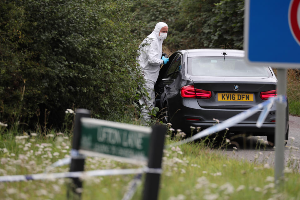 A police investigator at the scene of an incident on Ufton Lane, near Sulhamstead, Berkshire, where a Thames Valley Police officer was killed whilst attending a reported burglary on Thursday evening.