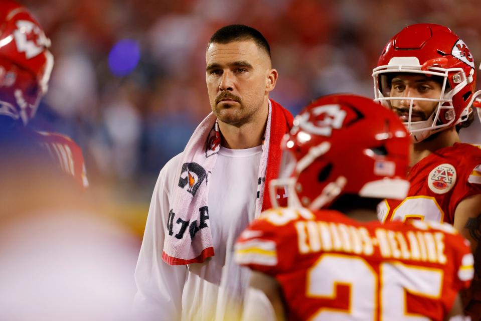 An injured Travis Kelce #87 of the Kansas City Chiefs looks on from the sideline against the Detroit Lions at GEHA Field at Arrowhead Stadium on September 07, 2023 in Kansas City, Missouri.