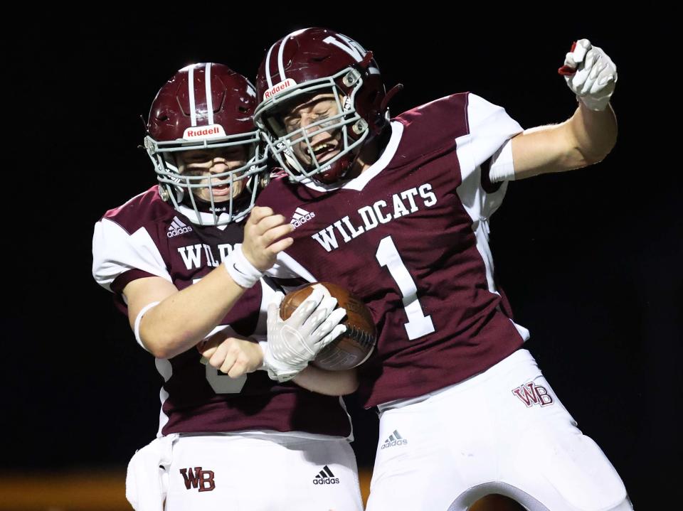 West Bridgewater receiver Luke Destrampe, right, is congratulated by Liam Collins, after he scored a touchdown during a game versus Rockland on Friday, Sept. 22, 2023.