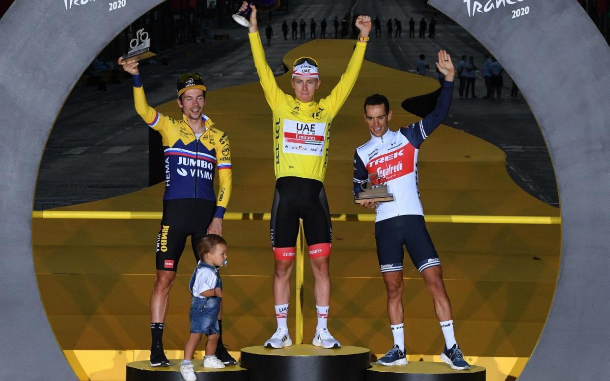 rimoz Roglic of Slovenia and Team Jumbo - Visma and his son Levom / Tadej Pogacar of Slovenia and UAE Team Emirates Yellow Leader Jersey / Richie Porte of Australia and Team Trek - Segafredo / Celebration / Trophy / during the 107th Tour de France 2020 - Stephan Mantey - Pool/Getty Images