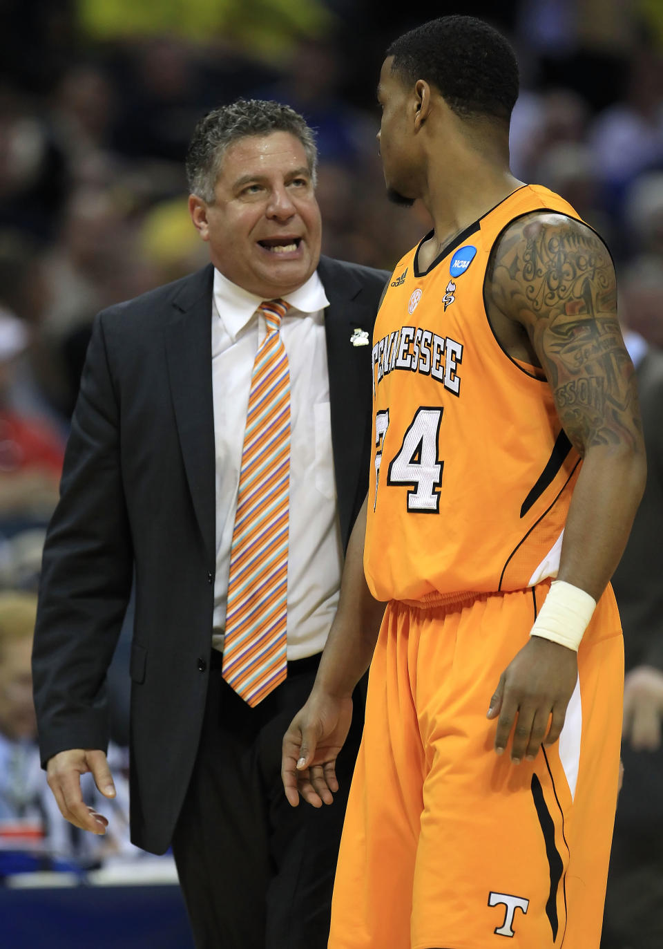 CHARLOTTE, NC - MARCH 18: Head coach Bruce Pearl of the Tennessee Volunteers talks with Josh Bone #24 in the second half while taking on the Michigan Wolverines during the second round of the 2011 NCAA men's basketball tournament at Time Warner Cable Arena on March 18, 2011 in Charlotte, North Carolina. (Photo by Streeter Lecka/Getty Images)