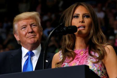 U.S. President Donald Trump (L) is introduced by first lady Melania at a rally with supporters in an arena in Youngstown, Ohio, U.S. July 25, 2017. REUTERS/Jonathan Ernst