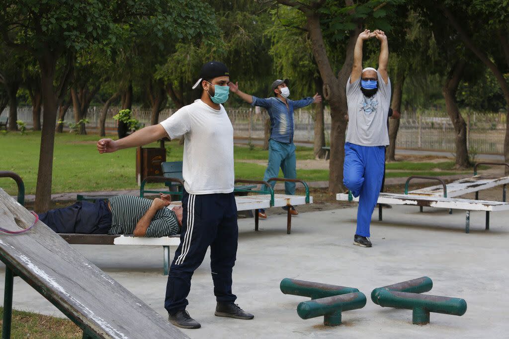 People exercise in a park in Lahore, Pakistan on June 5, 2020. The Government of Pakistan's Punjab province reopened parks in different cities of the province, including Lahore, following the coronavirus outbreak.