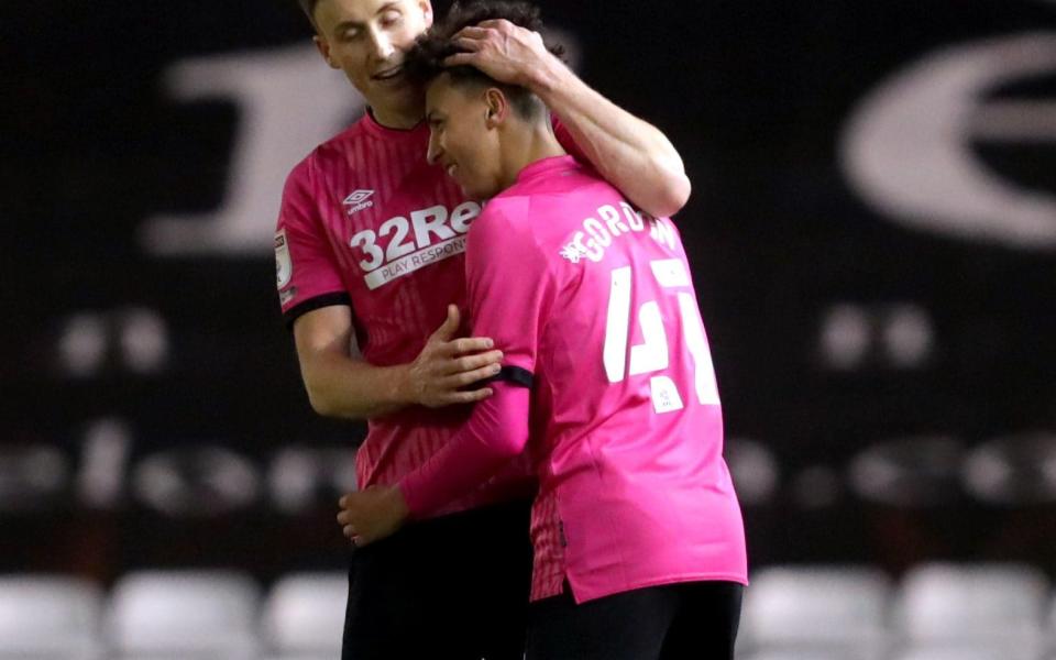 Kaide Gordon celebrates with Derby team-mate Craig Forsyth - PA