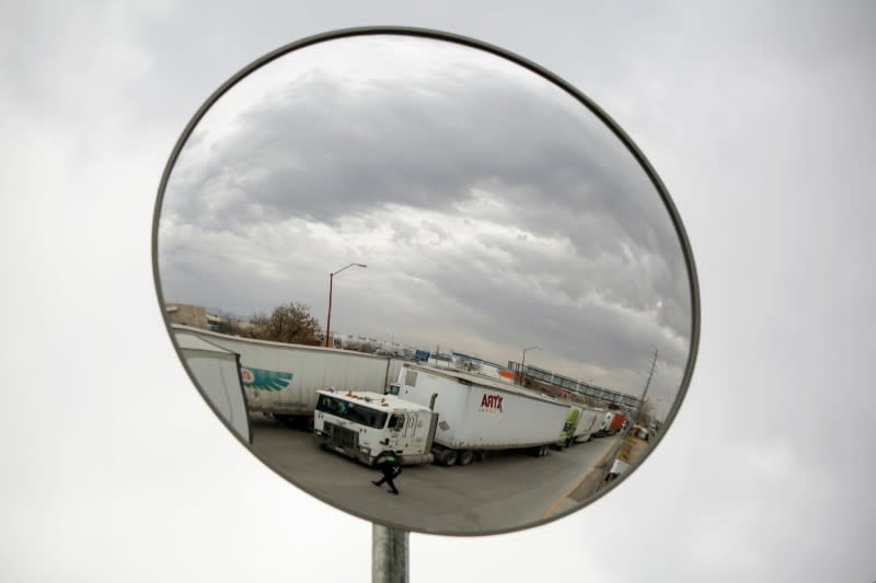 Trailers are reflected in a safety mirror while queued for border customs control at Zaragoza-Ysleta border crossing bridge, in Ciudad Juarez
