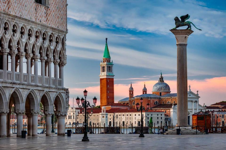 View from St Mark's Square to the church of San Giorgio Maggiore with the Doge's Palace (Palazzo Ducale) on the left. The winged lion of St Mark is the symbol of the city of Venice
