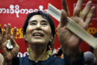 FILE - Myanmar's pro-democracy leader Aung San Suu Kyi gestures during her first press conference since her release from house arrest in Yangon, Myanmar on Nov. 14, 2010. Suu Kyi is the daughter of the country’s independence hero, Gen. Aung San, who was assassinated in 1947, less than six months before the country, then called Burma, became independent from Britain. Suu Kyi moved to New Delhi in 1960 when her mother was appointed ambassador to India and then spent most of her young adult life in the United States and England. Her career in politics began in 1988. (AP Photo, File)