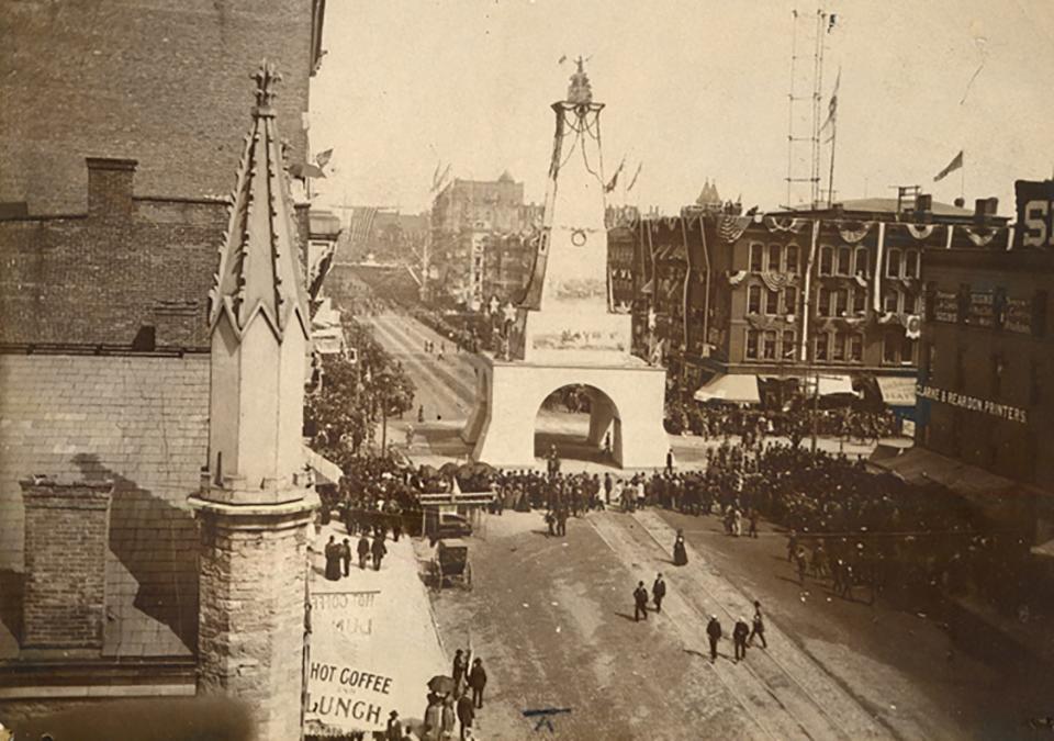 A photograph from the late 1800s showing the Mariners' Church with its spires, at left, at its original location on Woodward Avenue in Detroit on Saturday, July 22, 2023.